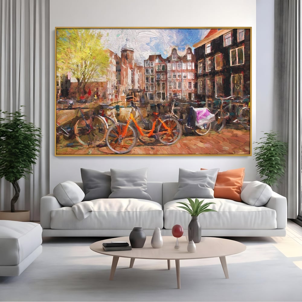 Tablou canvas cu tablou canvas cu bicicleta portocalie pe malul canalului, in rama de aluminiu auriu, pe perete intr-un living